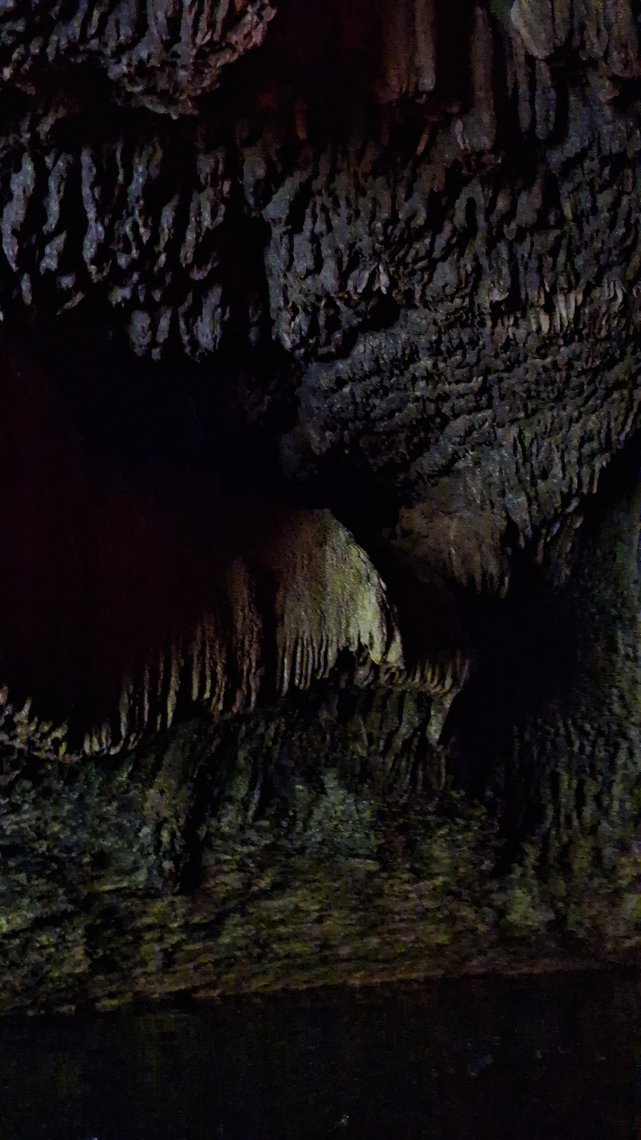 Dark cave interior with ancient rock formations