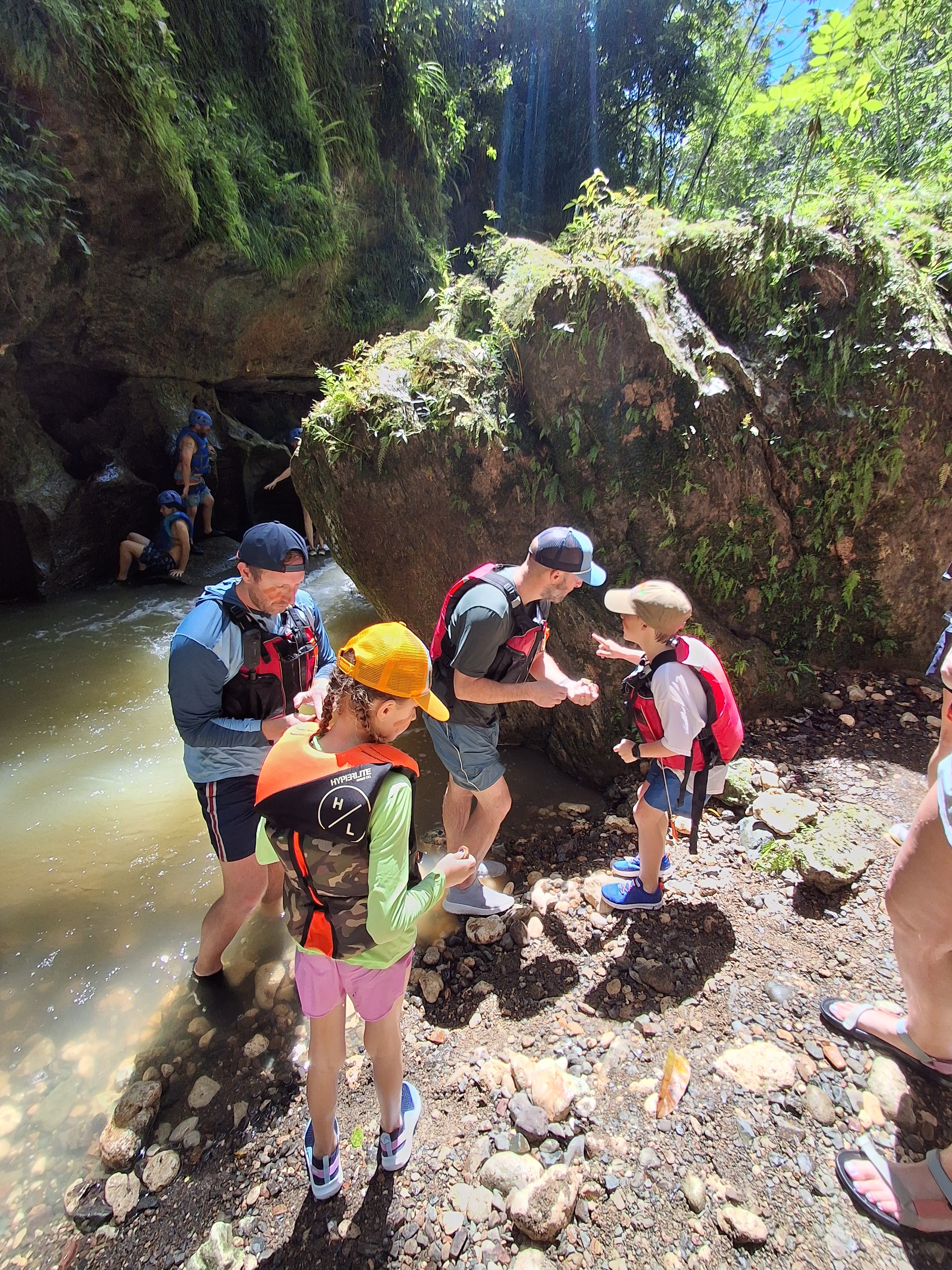 Guests exploring the karst canyon trail by the river